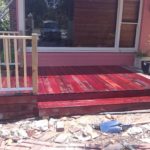 Photo of 140x22mm oiled jarrah decking with step and balustrade. Perth outdoor carpentry