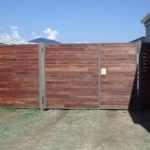steel gate clad in timber boards. Perth outdoor carpentry.
